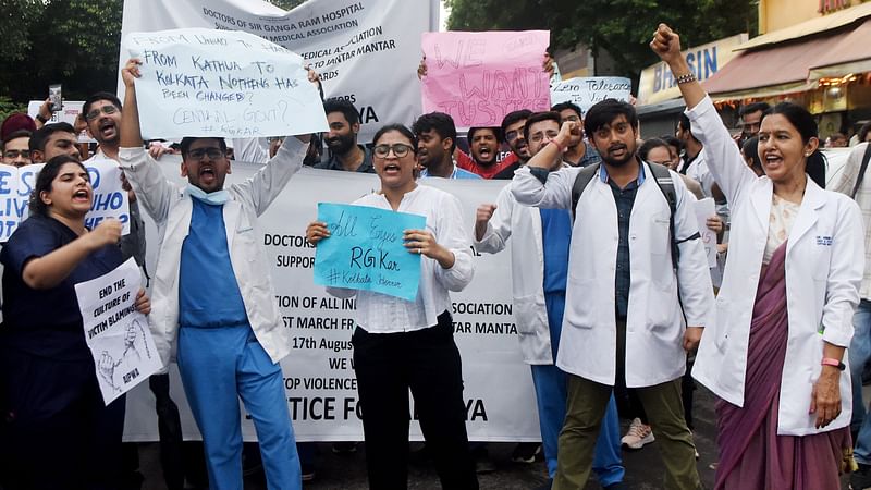 Physicians stage a protest against the sexual assault and murder of a postgraduate trainee physician at Kolkata RG Kar Hospital, in New Delhi on 17 August 2024